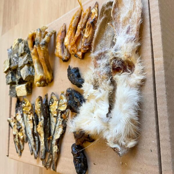 Natural Dog Treat Box Including 32 Natural Dog Chews and Treats. Rabbit Ears, Dried Sprats, Chicken Feet & Wings, Fish Cubes & Chicken Hearts or Bites. Suitable for Small, Medium and Large Adult Dogs. - Image 4